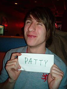 the author one evening became infatuated with pronouncing the word 'patty' (making sure to pronounce the 't' sound) and said it to the man in the picture, who happened to be British, and he thought it was funny.