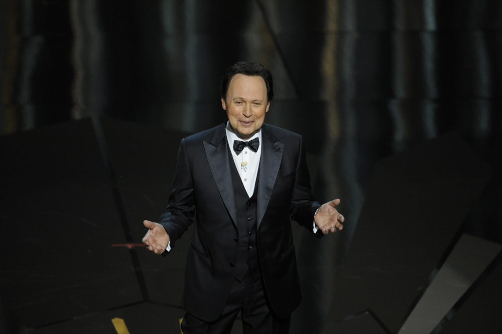 Host Billy Crystal speaks onstage during the 84th Academy Awards on Sunday, Feb. 26, 2012, in the Hollywood section of Los Angeles. (AP Photo/Mark J. Terrill)