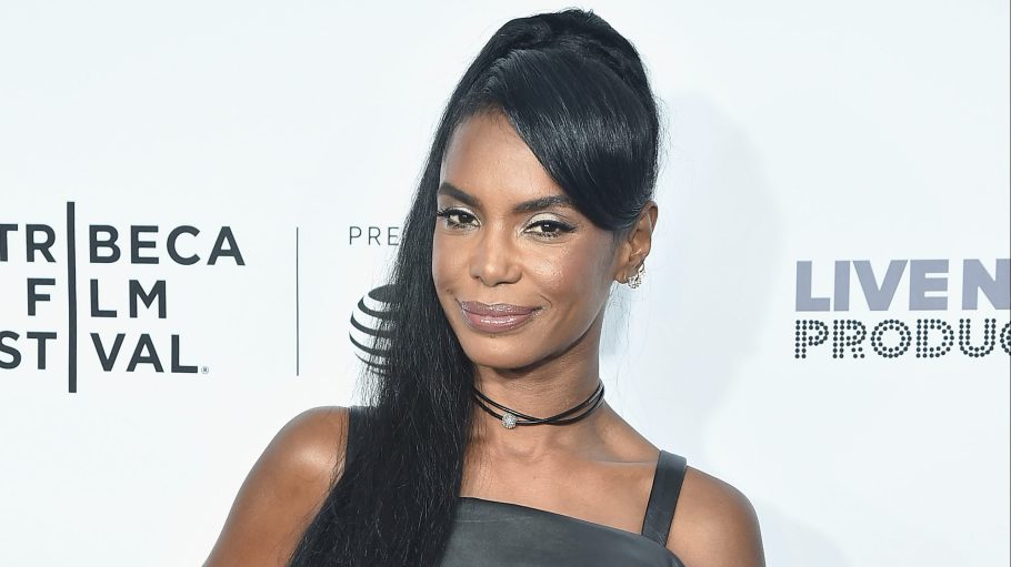 Kim Porter wearing black